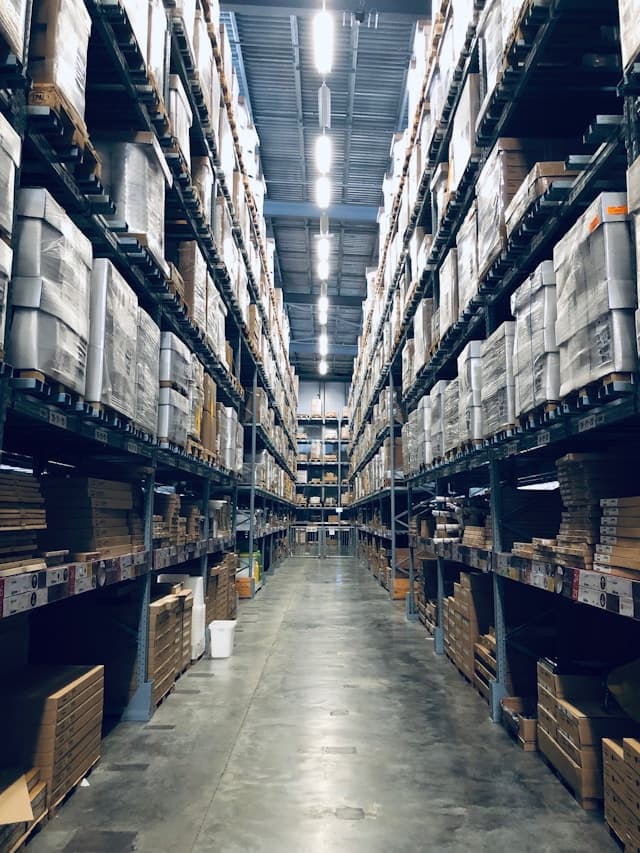 Climate-controlled warehouse interior with stacked drums